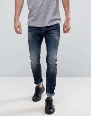 Выбеленные зауженные джинсы с потертостями United Colors of Benetton. Цвет: синий