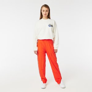Спортивная одежда Женские спортивные брюки Lacoste. Цвет: оранжевый