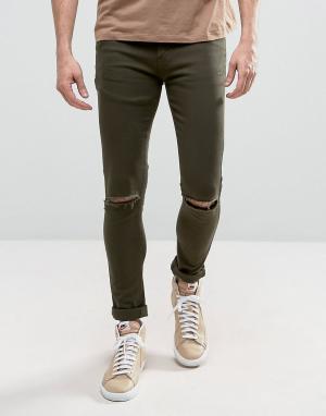 Супероблегающие джинсы с рваными коленями Criminal Damage. Цвет: зеленый