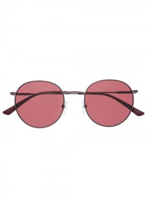 Солнцезащитные очки в круглой оправе Calvin Klein. Цвет: черный