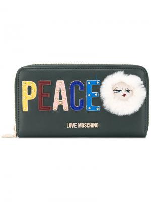 Кошелек с логотипом и надписью Peace Love Moschino. Цвет: зеленый