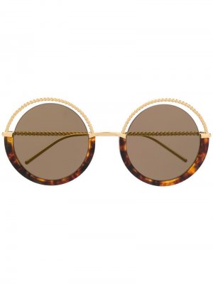 Солнцезащитные очки в черепаховой оправе Boucheron Eyewear. Цвет: коричневый