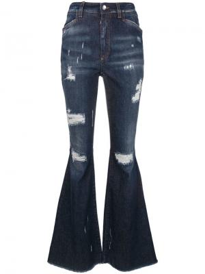 Слегка расклешенные джинсы с рваными деталями Dolce & Gabbana