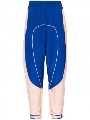 Зауженные спортивные брюки Li-Ning. Цвет: синий