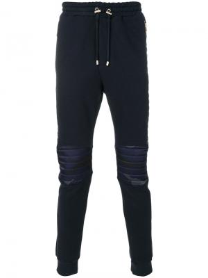 Спортивные брюки с камуфляжными панелями Balmain. Цвет: синий