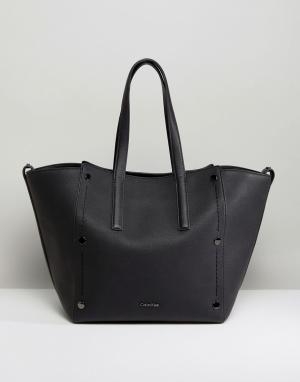Большая сумка-тоут с отделкой заклепками Calvin Klein. Цвет: черный