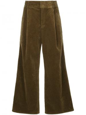Расклешенные брюки Estnation. Цвет: коричневый