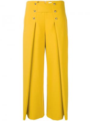 Расклешенные укороченные брюки Genny. Цвет: желтый
