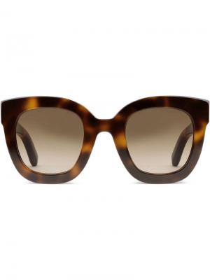 Солнцезащитные очки в круглой оправе Gucci Eyewear. Цвет: коричневый
