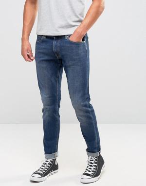 Зауженные джинсы с подвернутой кромкой ED-85 Edwin. Цвет: синий