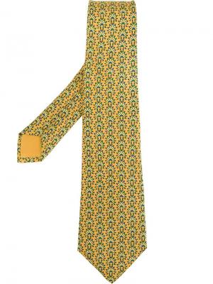 Галстук с принтом головного убора аборигенов Hermès Vintage. Цвет: жёлтый и оранжевый